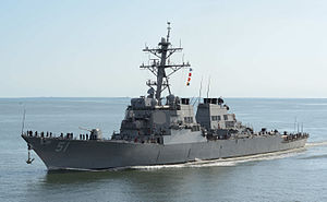A grey ship on the ocean.