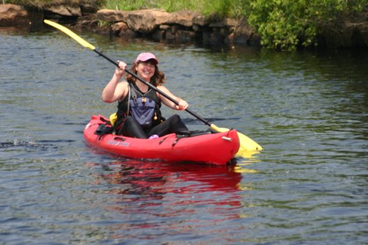 Samantha Ladd smiling again doing what she does best; leading a group of kayakers down the Westport River.